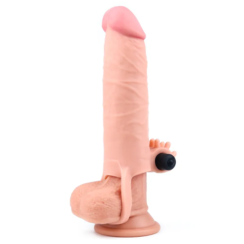 Navlaka za penis s vibracijom i prstenom za stabilnost oko testisa na dildu kao primjer kako stoji na penisu